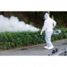 Operator in protective gear fogging street park,